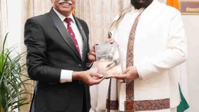 Dr Sanjay presents his books to governor
