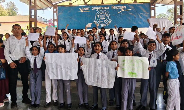 Parents & students protest after change in management of DRDO-run school PIONEER NEWS SERVICE/Dehradun A protest was held at the Defence Research and Development Organisation (DRDO) run Raksha Anusandhan Vidyalaya (RAV) in Sundarwala area of Raipur on Thursday morning after students, parents and teachers found that the school management had been transferred to another body and new staff taking charge on short notice. The school, which has been functioning under the DRDO Educational Society for years, saw angry scenes at its gate as existing staff alleged that they were not allowed to enter the premises. Even the principal was reportedly stopped at the entrance for some time. Bouncers were deployed at the gate as the situation turned tense. Students and parents gathered outside the campus and protested what they described as an “overnight privatisation” of the school. Some students also removed the newly installed DAV banner and raised slogans, saying that they did not want the school to be handed over to a private institution. Parents said that they had received no prior information about the change in management. Archana Sharma, whose child studies in class VI, said that the decision had left families worried. “We came to know about the change only when the children reached school in the morning. A decision like this in the middle of the academic session creates uncertainty about studies and fees,” she said. Some students also alleged that the inappropriate behaviour by members of the new staff. Teacher Rajeev Pathak said that they had already challenged the proposed handover process in the Delhi High Court in November 2025 after learning about plans to invite private institutions to run the school. He questioned how the transition could take place while the matter was still pending in court. Established in 1993, the RAV mainly caters to children of DRDO employees and families from economically weaker sections. Around 150 students are currently enrolled in the school. DRDO officials visited the campus later in the day to assess the situation. The new principal Rajat Dusseja stated that the management change was aimed at improving the school. He assured that better facilities, including sports infrastructure and qualified staff, would be introduced. He also stated that there would be no immediate changes in uniform or books and that reforms would be implemented gradually.