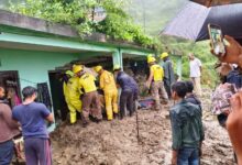 Rescue teams at the home where three died after a disaster