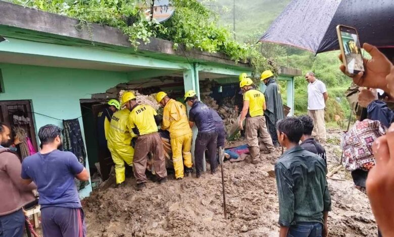 Rescue teams at the home where three died after a disaster